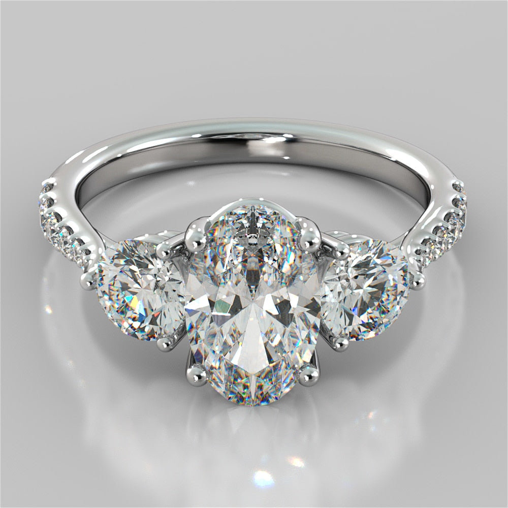 Oval Cut Accented Three-Stone Wedding Set With 2 Matching Bands