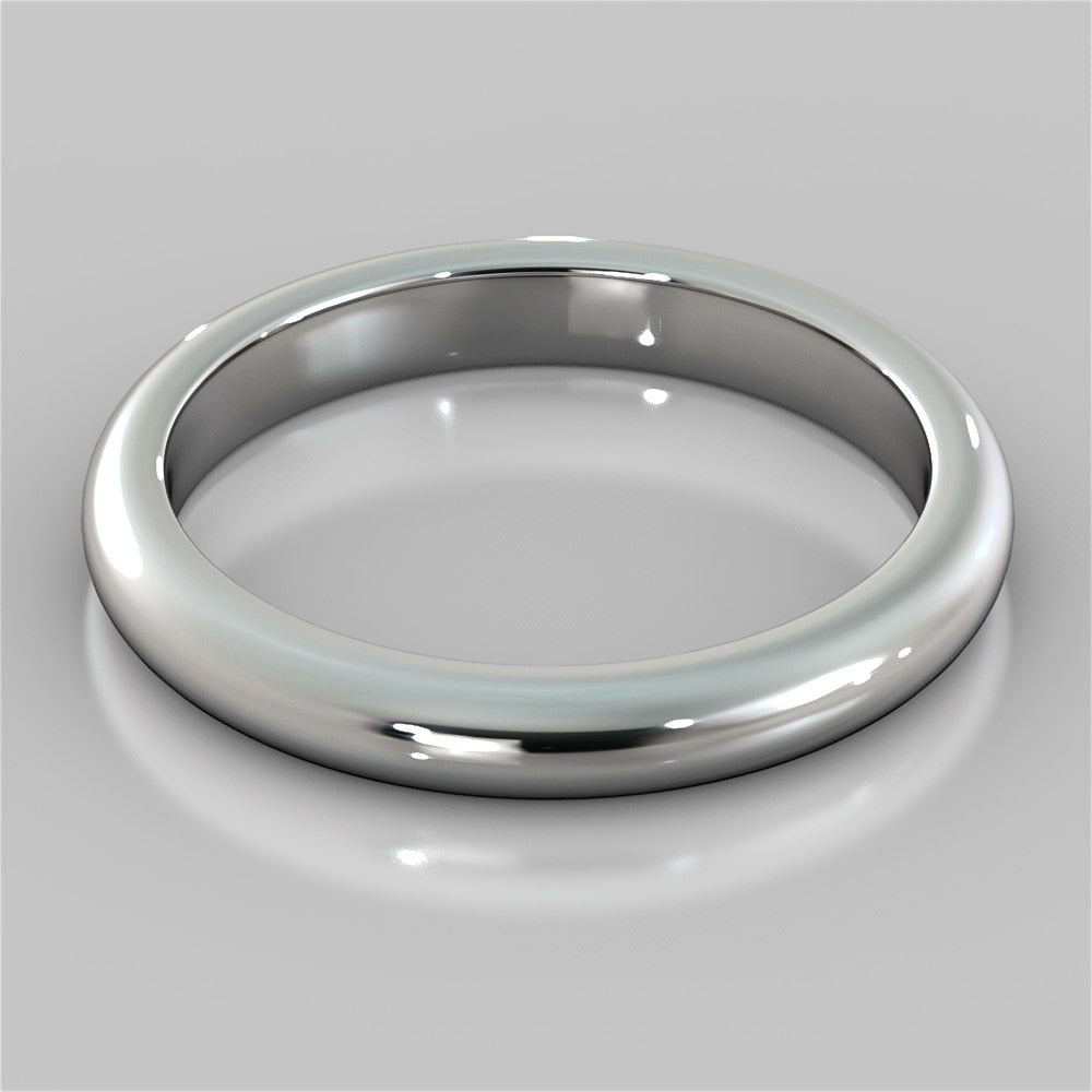 Silver ring on a reflective gray surface