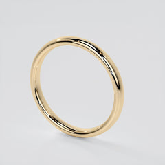 Gold ring on a light gray background