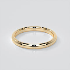 Gold ring on a light gray background