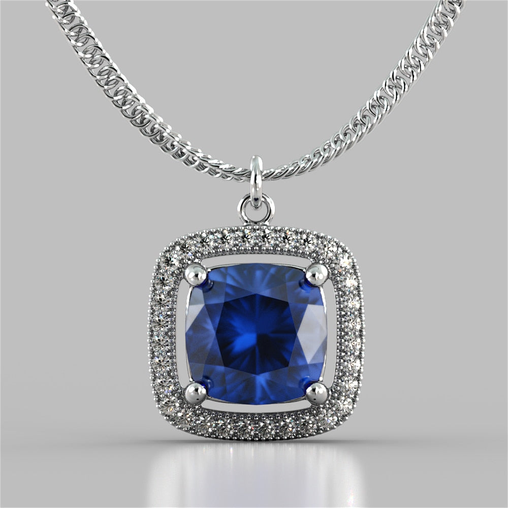 Cushion Style Halo Pendant with Round Cut Color Center Stone