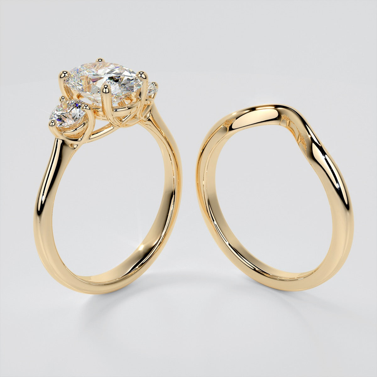 Oval Cut Three-Stone Trio Wedding Set