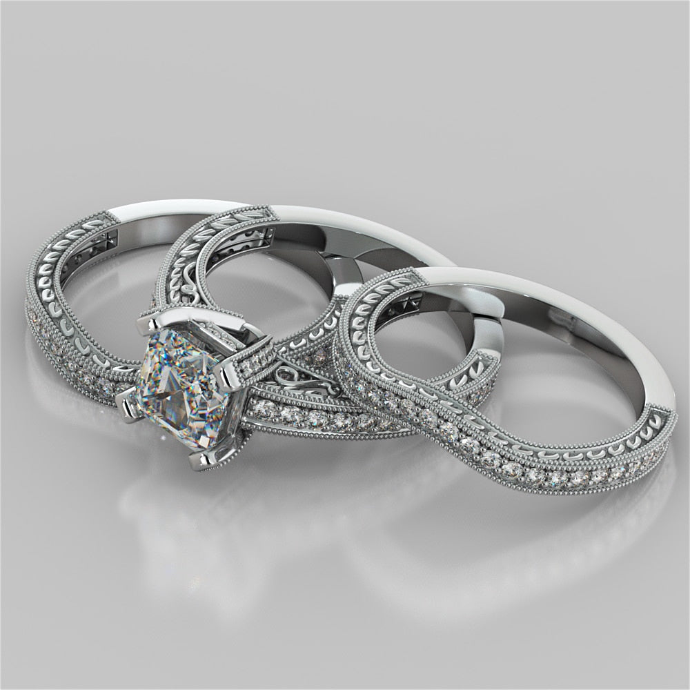 Asscher Cut Trio Wedding Set with Tapered Filigree Shoulders and Round Accents