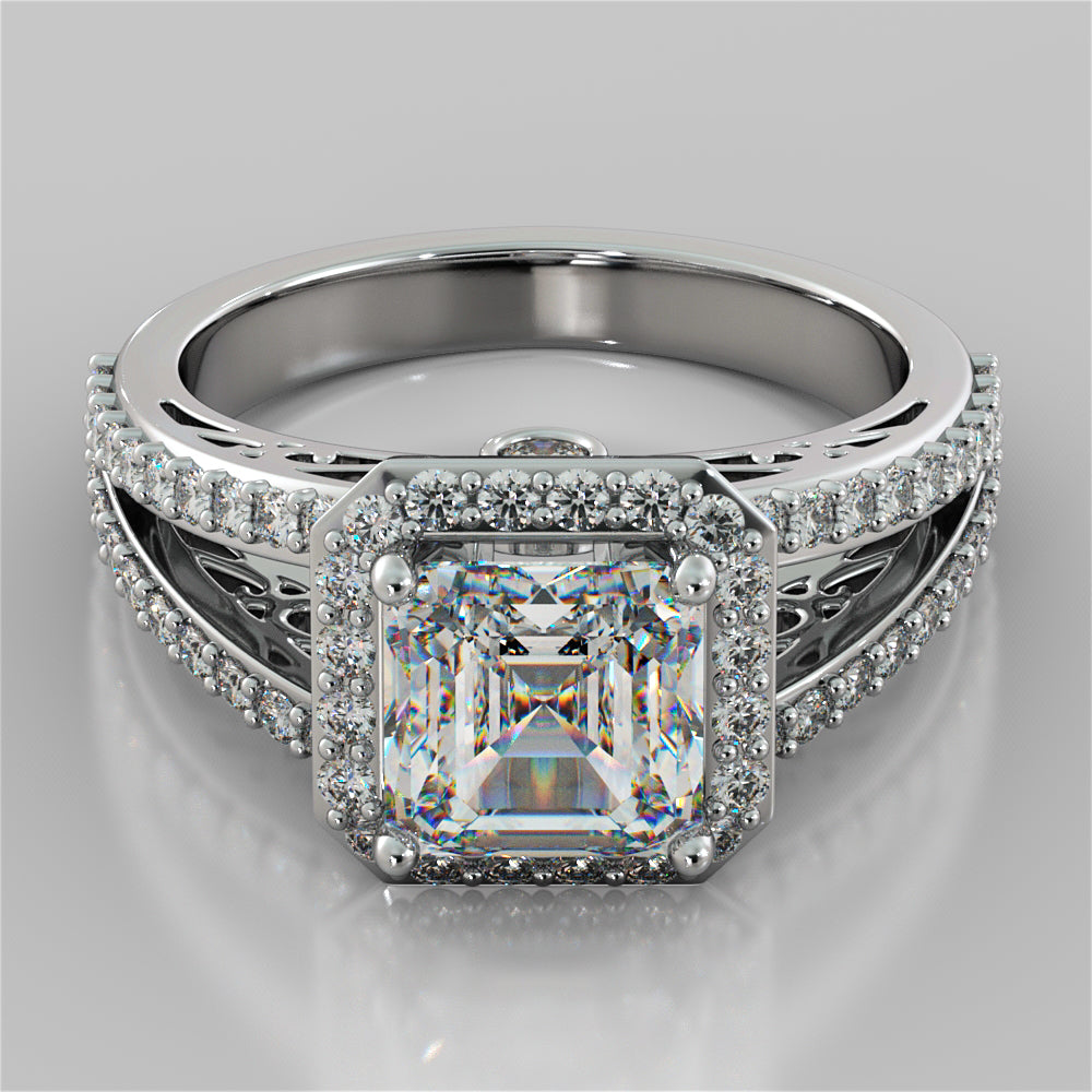 Silver ring with a large diamond and smaller diamonds on a gray background