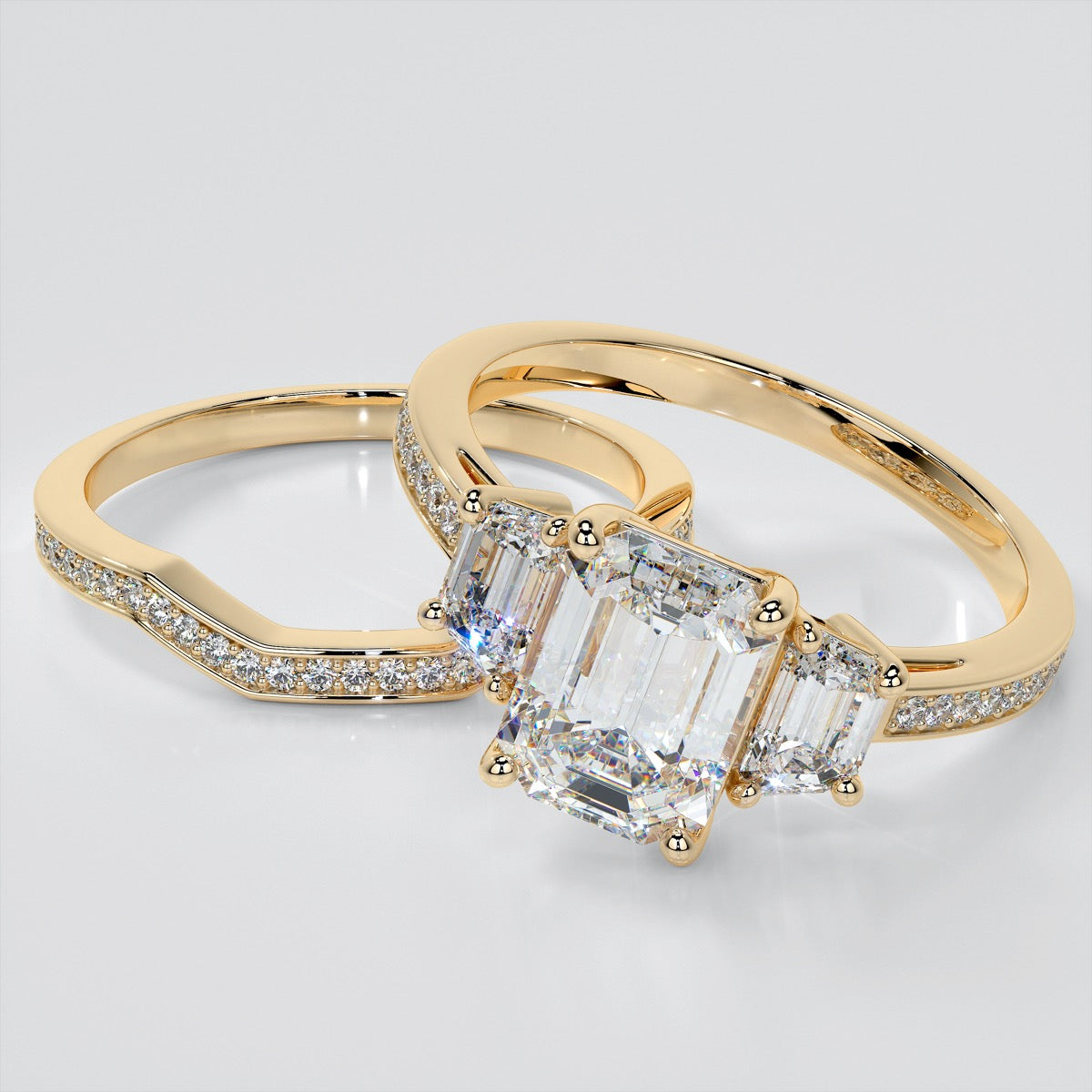 Emerald Cut Three-Stone Engagement Ring With Trapezoid Accents