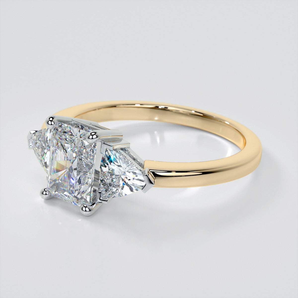 Radiant Cut Three-Stone Engagement Ring With Trillion Accents