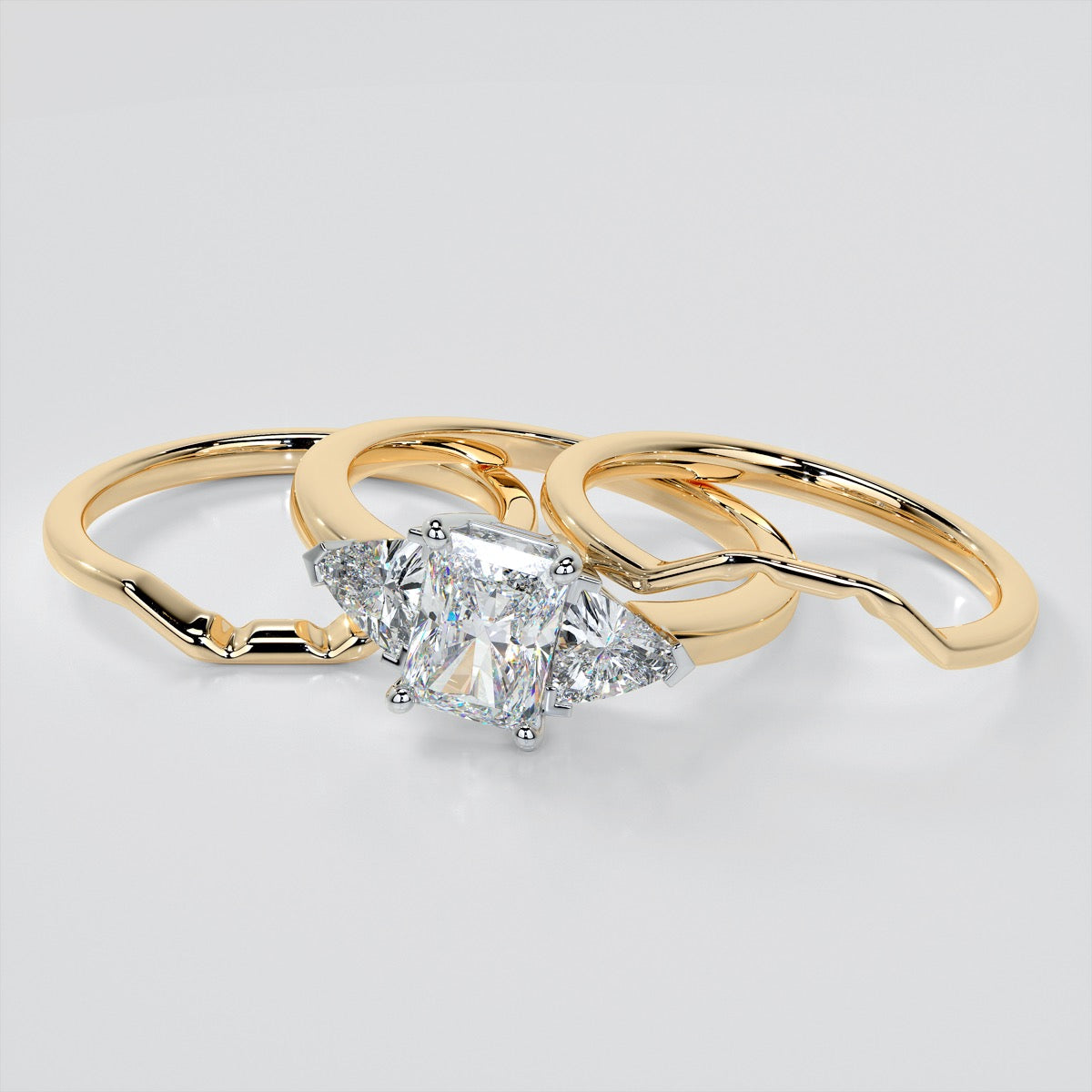 Radiant Cut Three-Stone Engagement Ring With Trillion Accents