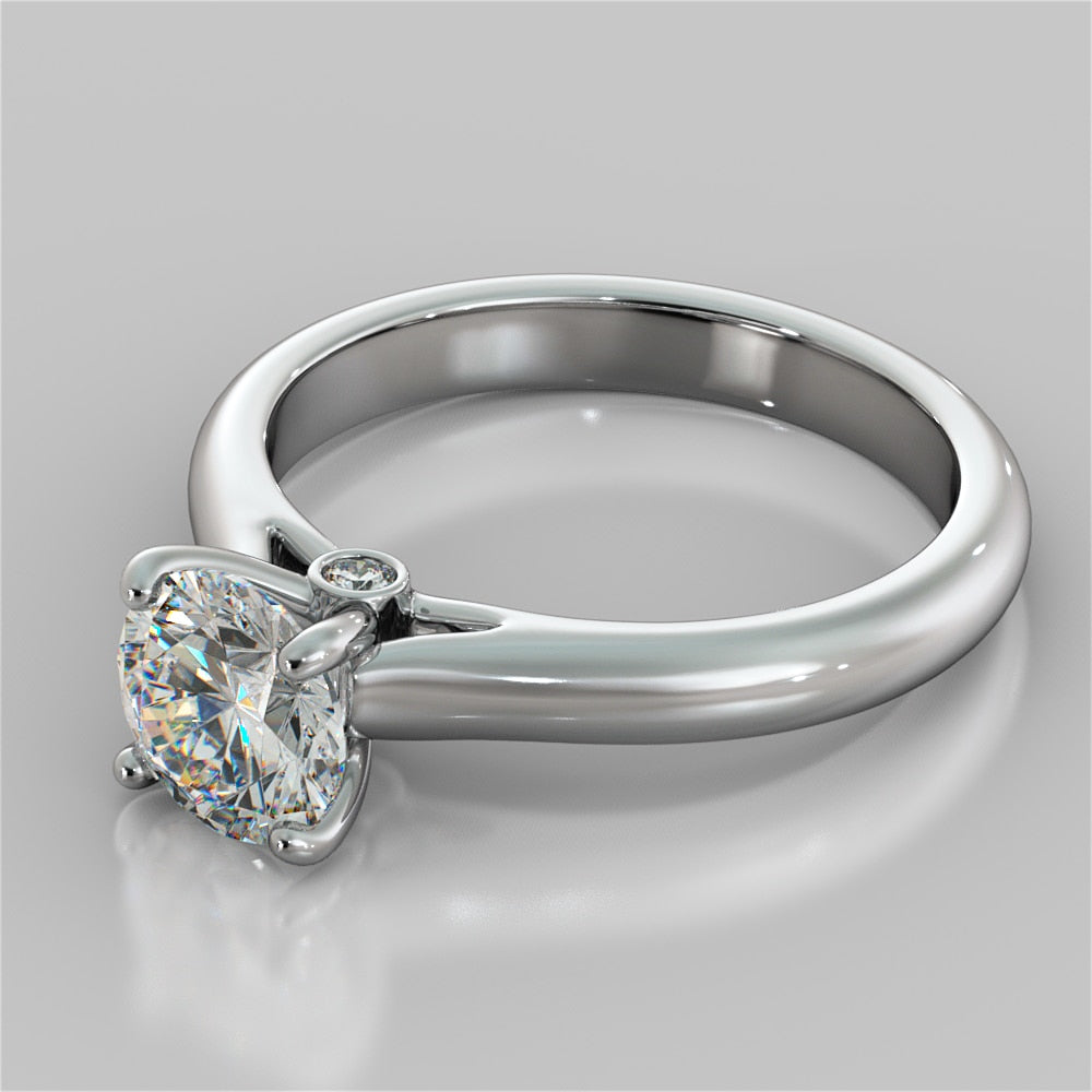 Round Cut Cathedral Engagement Ring With Accents