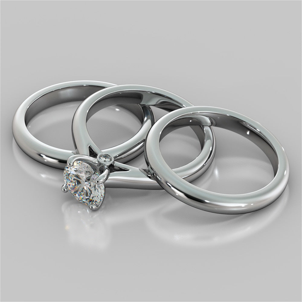 Round Cut Cathedral Engagement Ring With Accents