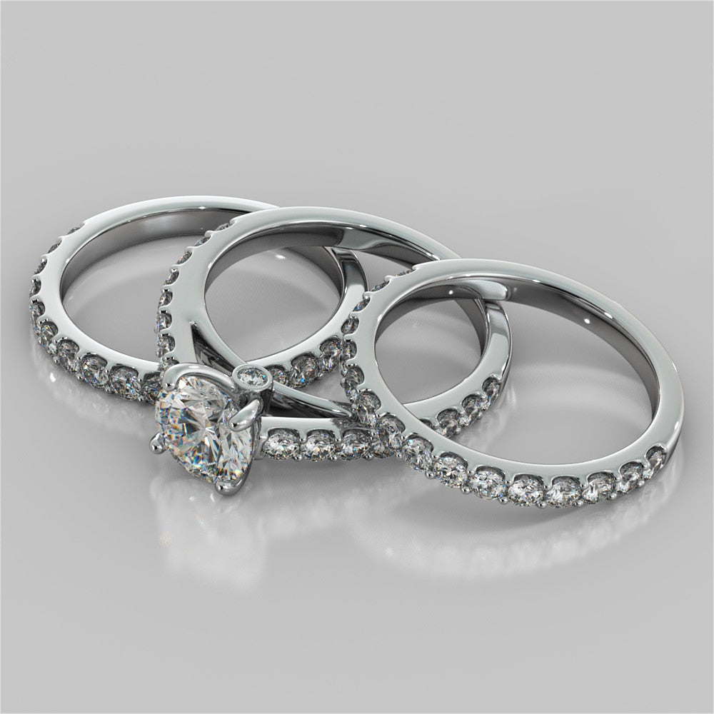 Round Cut Cathedral Style Engagement Ring With Side Accents